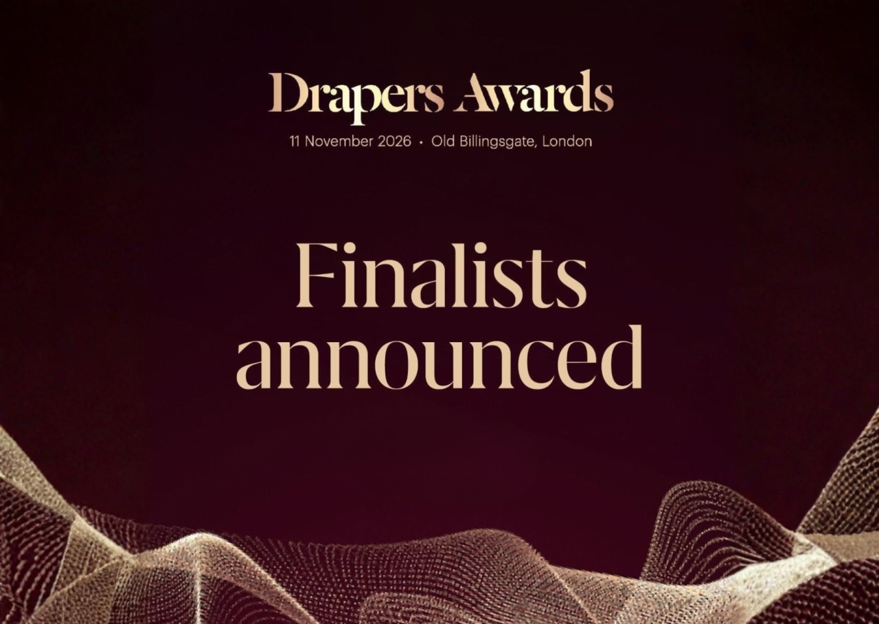 Text announcing the finalists for the Drapers Awards, taking place on November 11, 2026, at Old Billingsgate, London. The background features a flowing design with a gradient of warm colors.